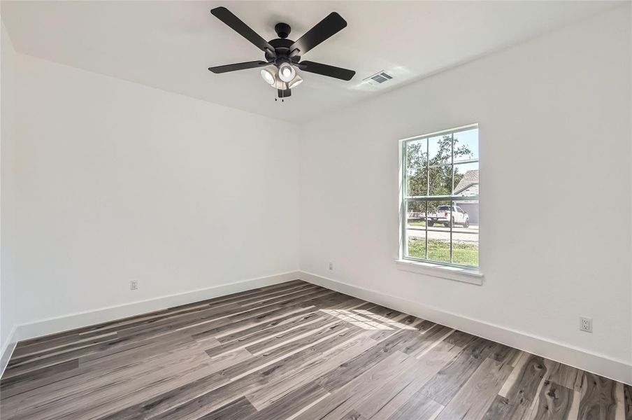 Another view of Bedroom 4 with ceiling fan