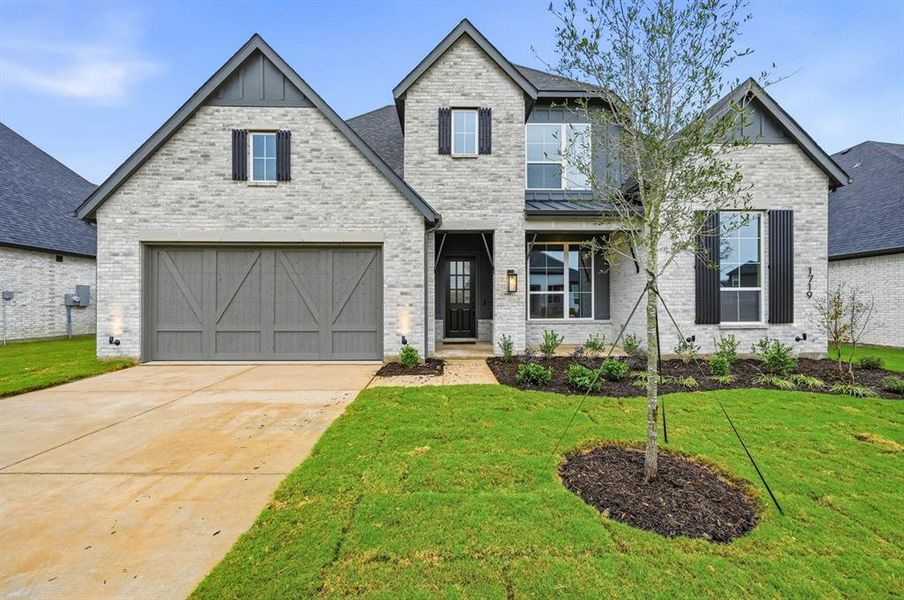 Front exterior of a new home in Sonoma Verde: 70ft. lots, McLendon-Chisholm, TX, highlighting curb appeal (Image 1).