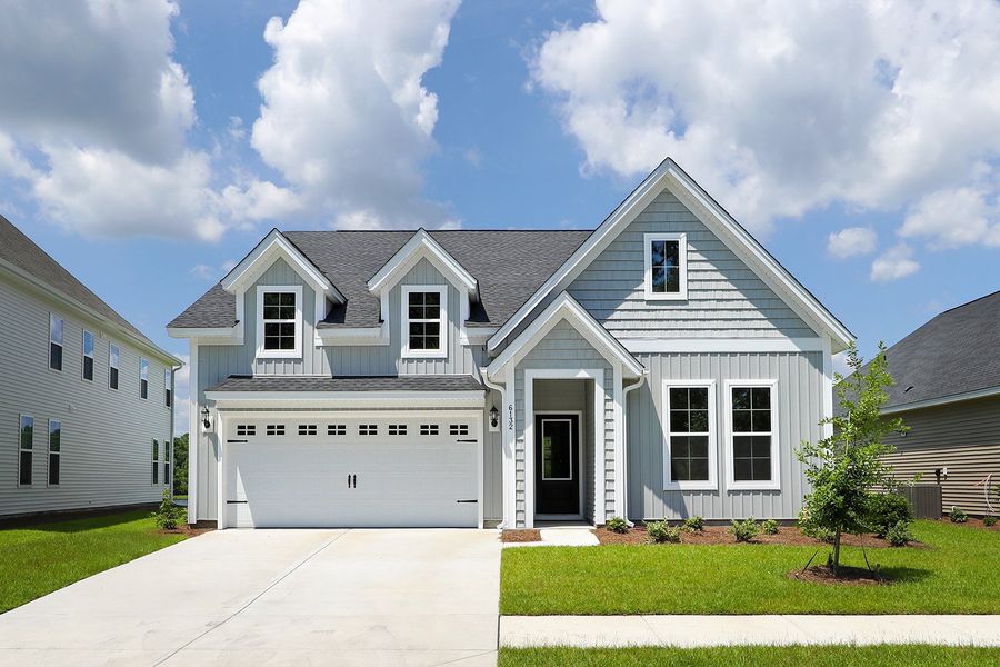 Front exterior of a new home in Arcadia, Myrtle Beach, SC, highlighting curb appeal (Image 1). Front exterior of a new home in Arcadia, Myrtle Beach, SC, highlighting curb appeal (Image 1).