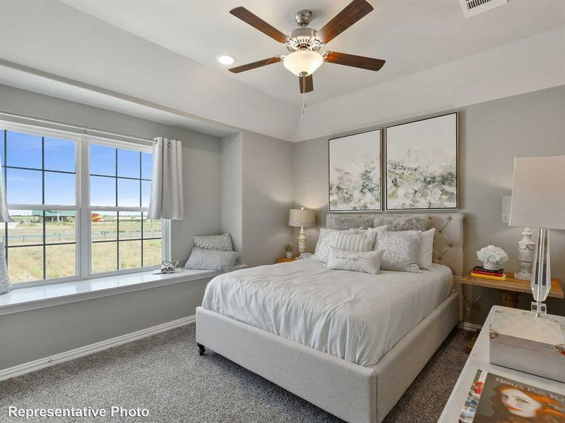 Bedroom with carpet and ceiling fan