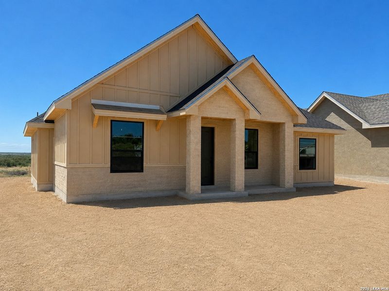Front exterior of a new home in , Eagle Pass, TX, highlighting curb appeal (Image 2). Front exterior of a new home in , Eagle Pass, TX, highlighting curb appeal (Image 2).