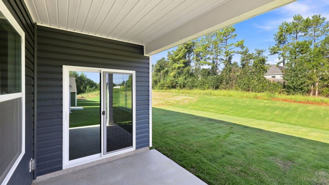 Exterior details and patio area of a home in Durbin Meadows Traditions, Fountain Inn (Image 17).