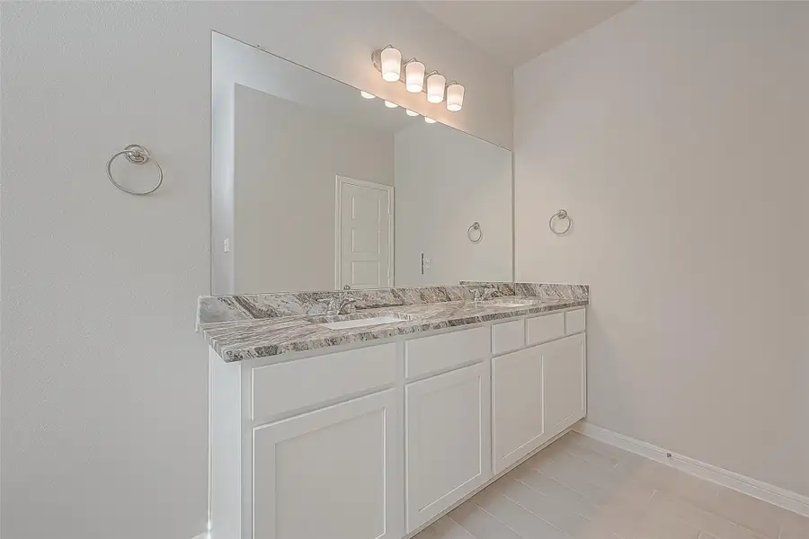 Furnished interior view inside a new home in Mill Creek Trails, Magnolia (Image 10).