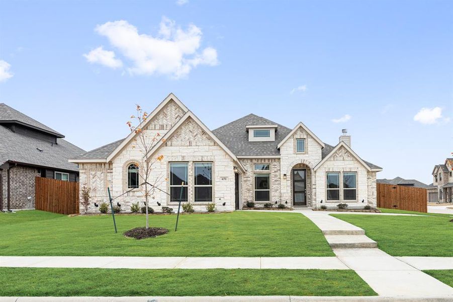 Front exterior of a new home in Sunrise at Garden Valley, Waxahachie, TX, highlighting curb appeal (Image 2).