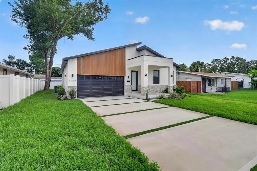 Front exterior of a new home in , St. Petersburg, FL, highlighting curb appeal (Image 2). Front exterior of a new home in , St. Petersburg, FL, highlighting curb appeal (Image 2).