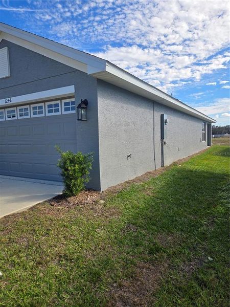 Exterior details and patio area of a home in Wyld Palms, Inverness (Image 3).