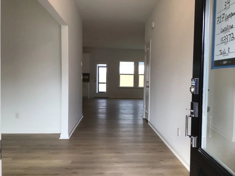 Foyer featuring the AW Collection® Coastal - Light floors and airy tones set a relaxed tone.