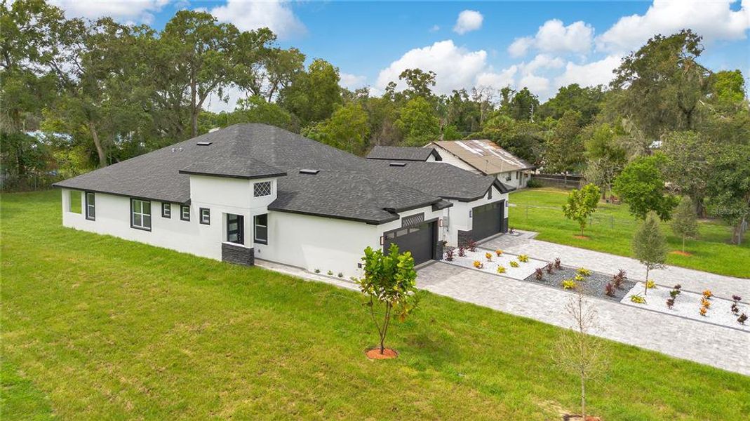 Front exterior of a new home in , Apopka, FL, highlighting curb appeal (Image 24).
