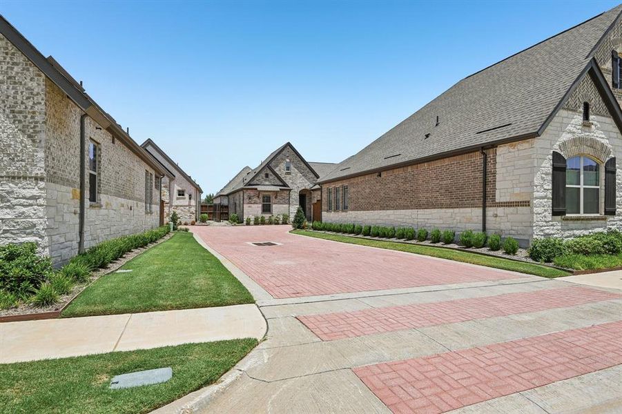 Front exterior of a new home in Elements at Viridian - Garden Series, Arlington, TX, highlighting curb appeal (Image 19). Front exterior of a new home in Elements at Viridian - Garden Series, Arlington, TX, highlighting curb appeal (Image 19).