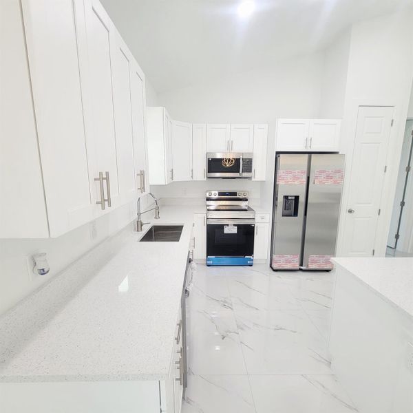 Furnished interior view inside a new home in , Okeechobee (Image 7).