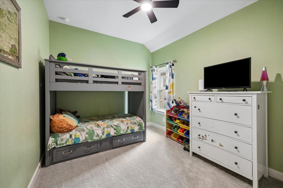 Bright and versatile secondary bedroom featuring soft neutral finishes, plush carpeting, and a peaceful ambiance. Bright and versatile secondary bedroom featuring soft neutral finishes, plush carpeting, and a peaceful ambiance.