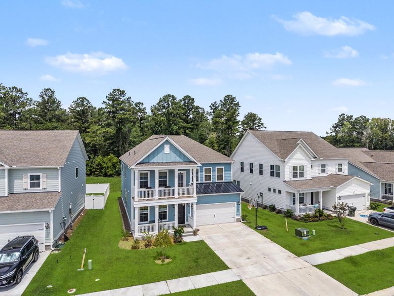 Front exterior of a new home in Tidewater at Lakes of Cane Bay, Summerville, SC, highlighting curb appeal (Image 25).