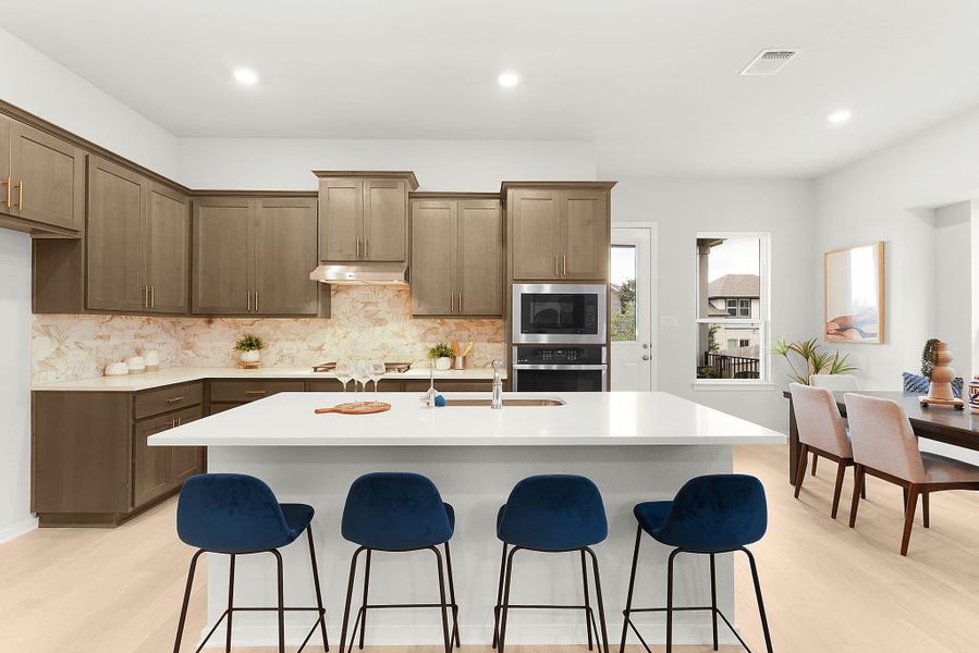 Representative furnished interior of a home built from the Wilson by Chesmar Homes in Deerbrooke Cottages, Leander (Image 6).