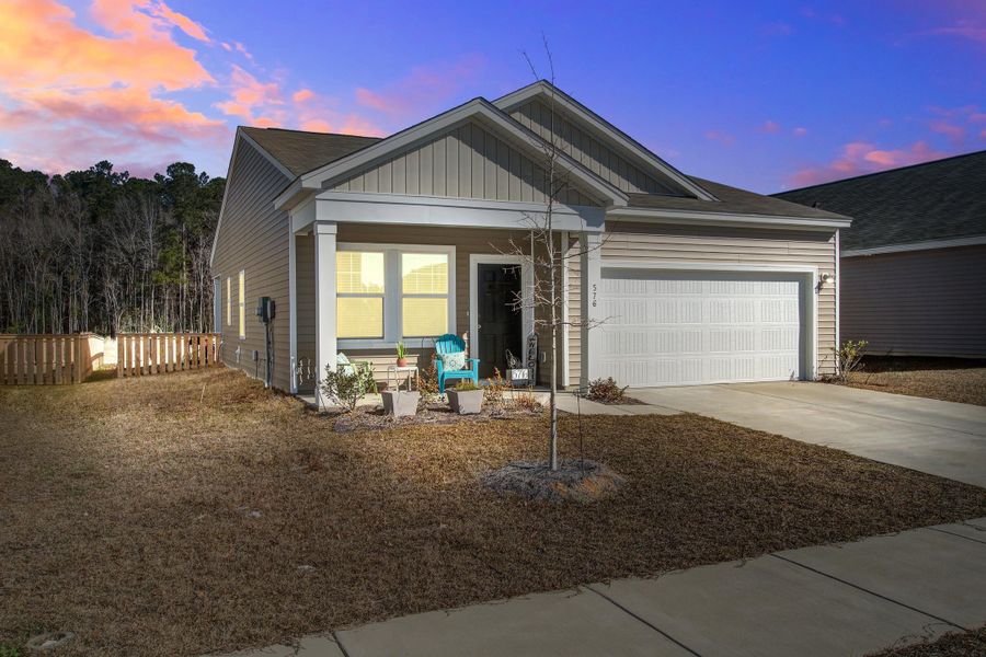 Front exterior of a new home in Pender Woods at Cane Bay, Summerville, SC, highlighting curb appeal (Image 20).