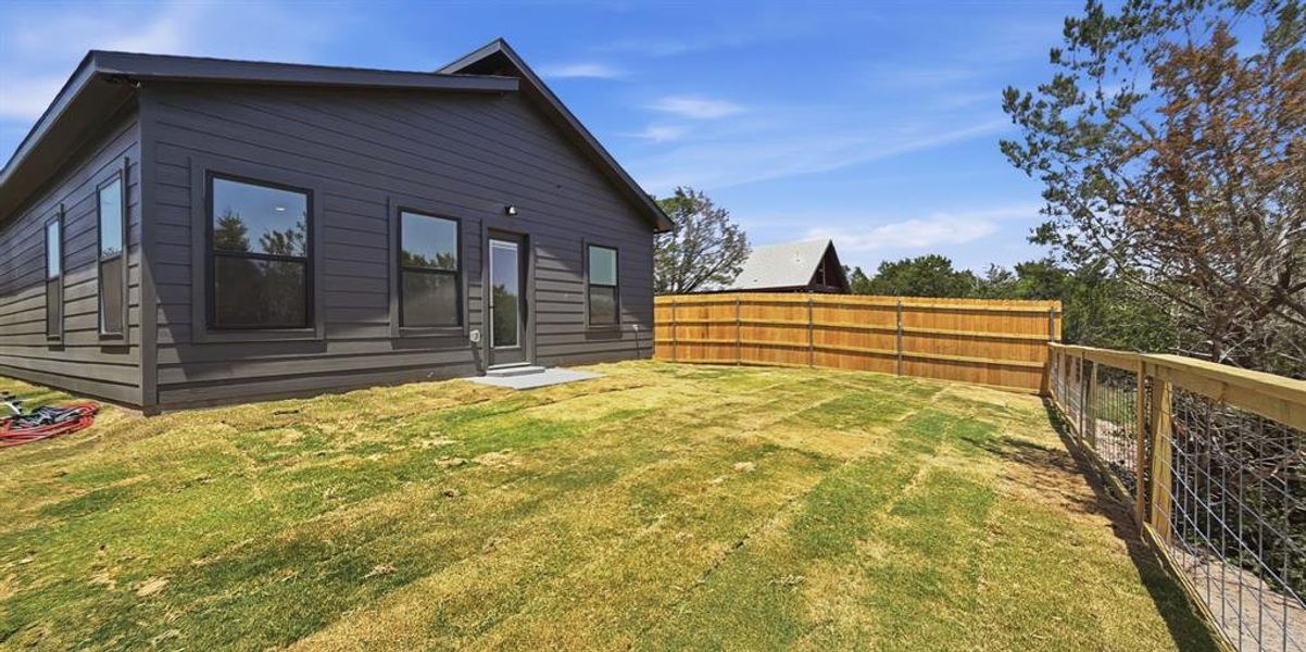 Exterior details and patio area of a home in , Granbury (Image 21).
