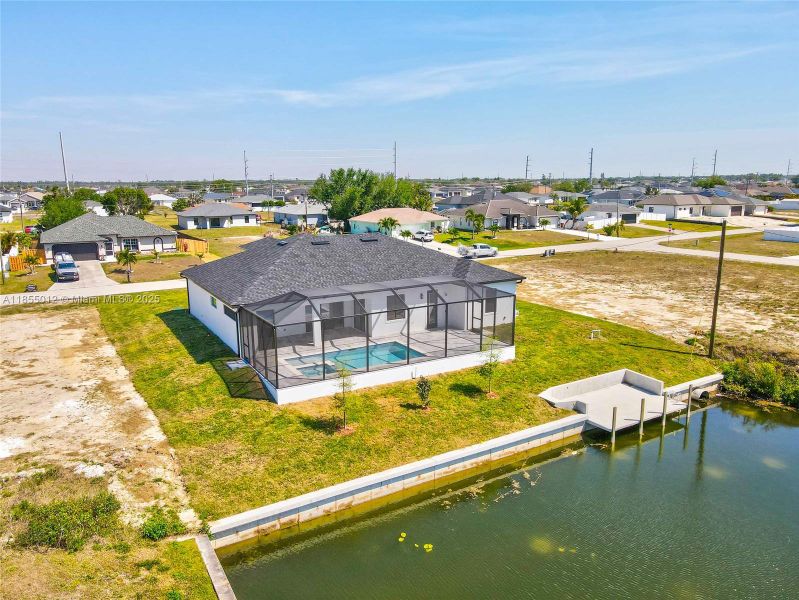 Drone / aerial view featuring a residential view and a water view