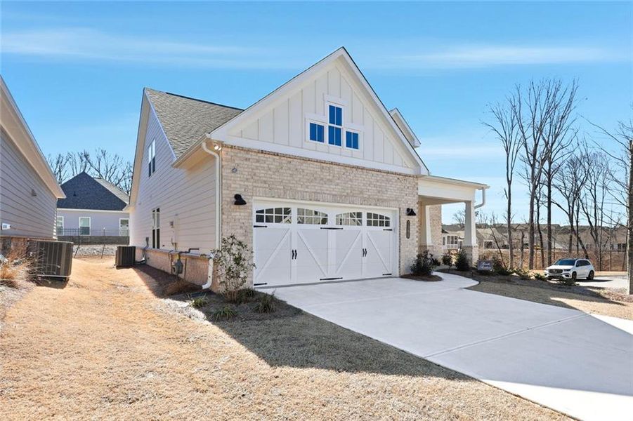 Front exterior of a new home in , Cumming, GA, highlighting curb appeal (Image 27).