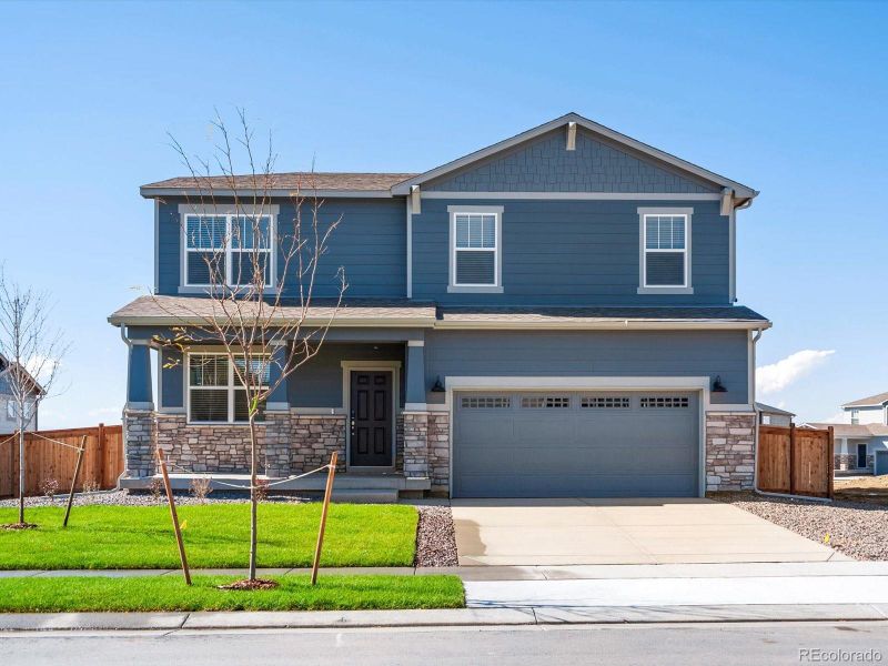 Front exterior of a new home in Buffalo Highlands: The Canyon Collection, Commerce City, CO, highlighting curb appeal (Image 1). Front exterior of a new home in Buffalo Highlands: The Canyon Collection, Commerce City, CO, highlighting curb appeal (Image 1).