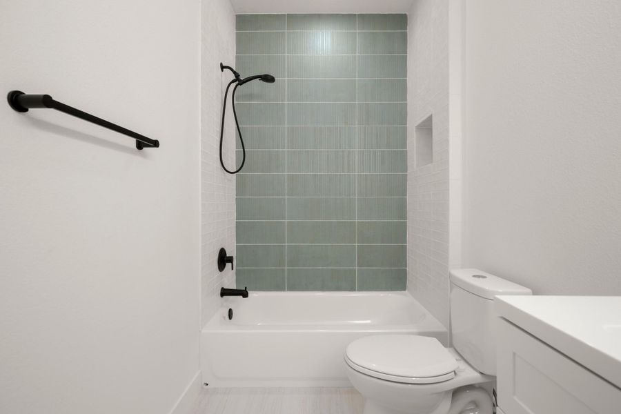 Bathroom featuring vanity and bathtub / shower combination