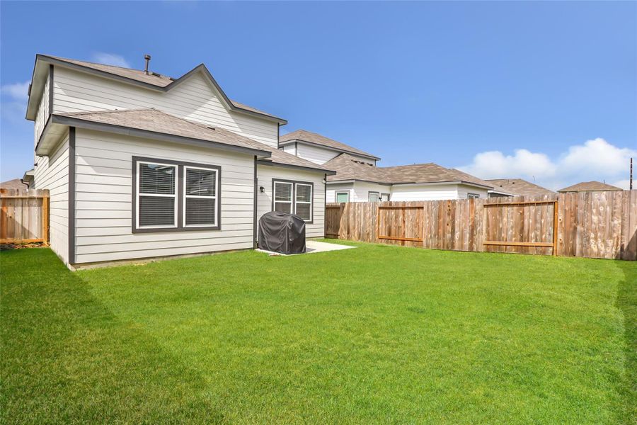 Exterior details and patio area of a home in Barrett Crossing, Crosby (Image 25).