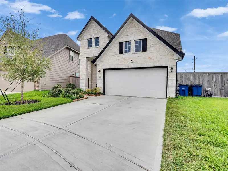 Front exterior of a new home in Park Lakes East, Humble, TX, highlighting curb appeal (Image 2). Front exterior of a new home in Park Lakes East, Humble, TX, highlighting curb appeal (Image 2).