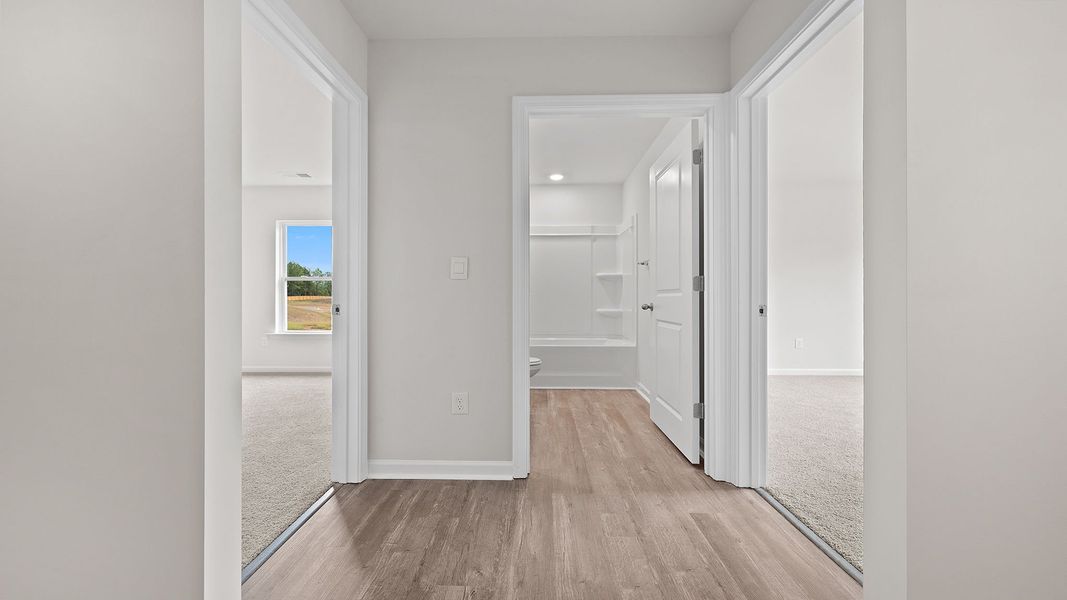Spacious, unfurnished interior of a new home in Bentley Park, Greenwood (Image 11).