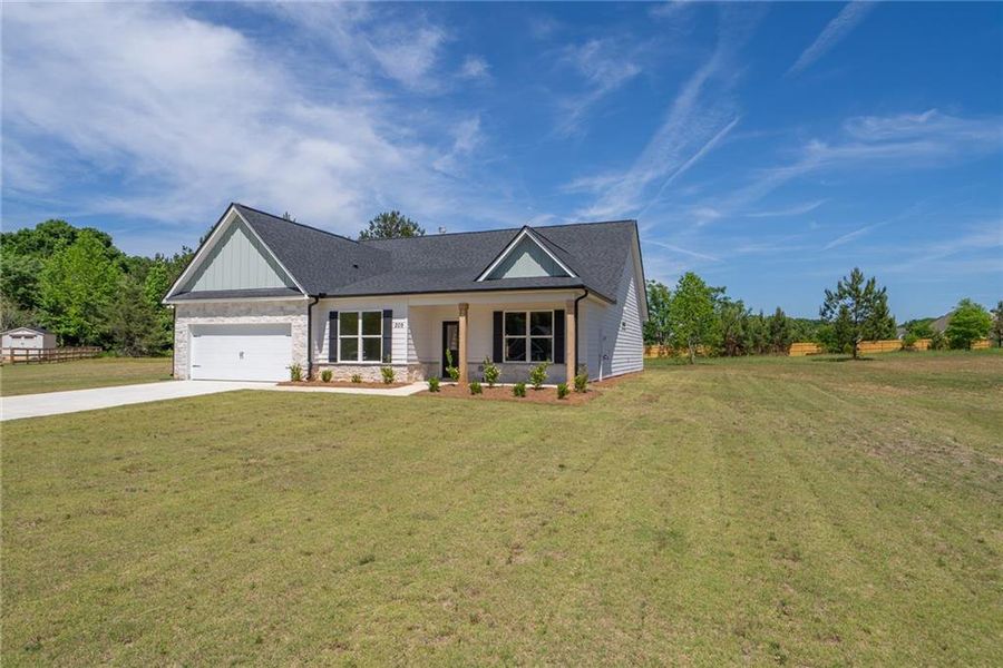 Front exterior of a new home in , Good Hope, GA, highlighting curb appeal (Image 20). Front exterior of a new home in , Good Hope, GA, highlighting curb appeal (Image 20).
