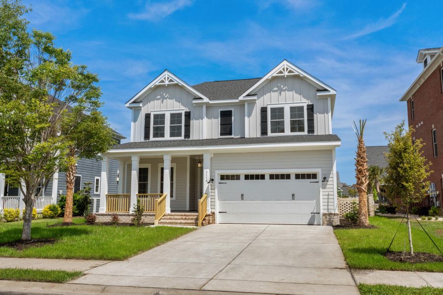 Front exterior of a new home in Creek Pointe, Moncks Corner, SC, highlighting curb appeal (Image 1). Front exterior of a new home in Creek Pointe, Moncks Corner, SC, highlighting curb appeal (Image 1).