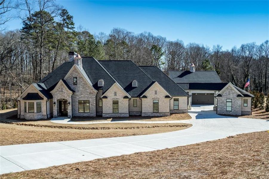Front exterior of a new home in , Woodstock, GA, highlighting curb appeal (Image 26).
