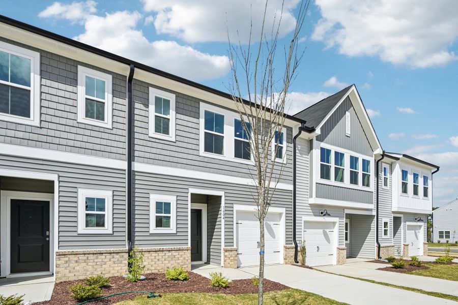 Front exterior of a new home in Towns at The Point, Rolesville, NC, highlighting curb appeal (Image 19).