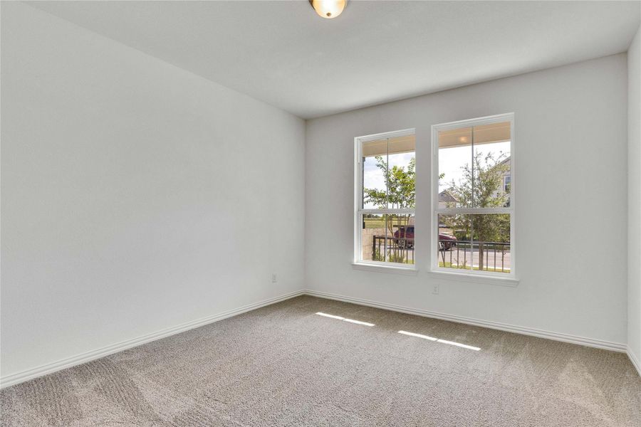 Unfurnished room featuring carpet flooring and baseboards Unfurnished room featuring carpet flooring and baseboards