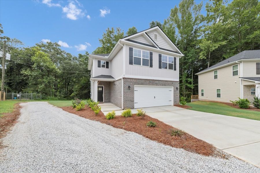 Front exterior of a new home in Scarlett Place, Bowdon, GA, highlighting curb appeal (Image 21).