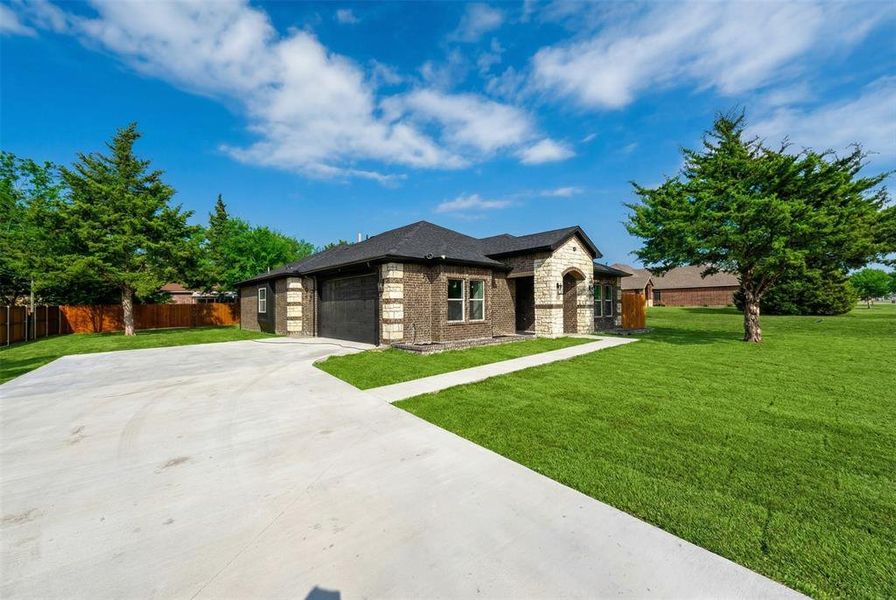 Front exterior of a new home in , Glenn Heights, TX, highlighting curb appeal (Image 1). Front exterior of a new home in , Glenn Heights, TX, highlighting curb appeal (Image 1).