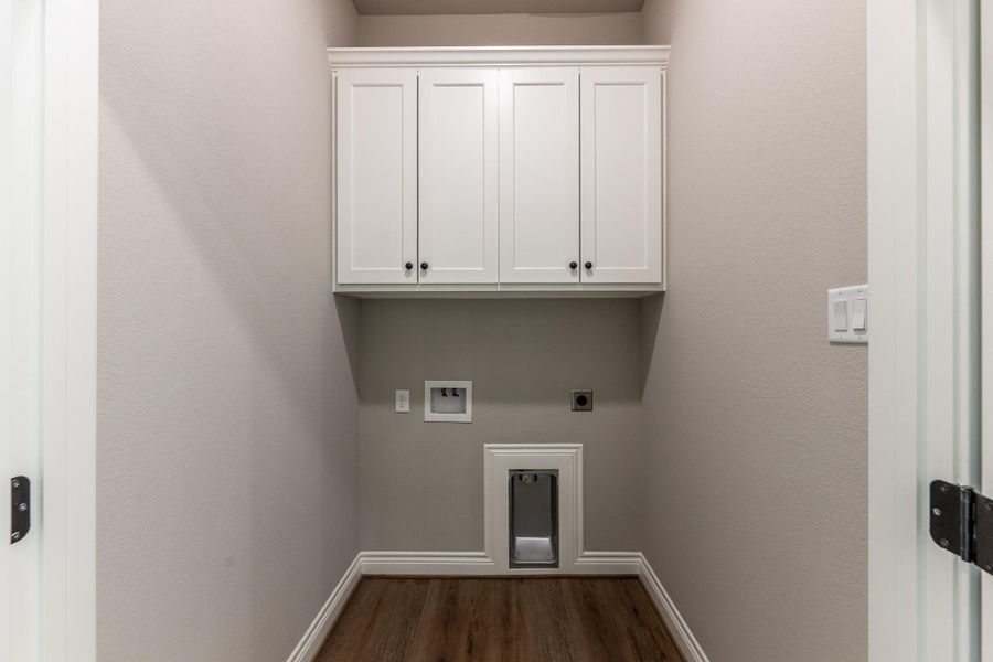 Laundry area with full sized doors