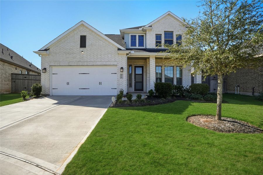 Front exterior of a new home in , Fulshear, TX, highlighting curb appeal (Image 29). Front exterior of a new home in , Fulshear, TX, highlighting curb appeal (Image 29).