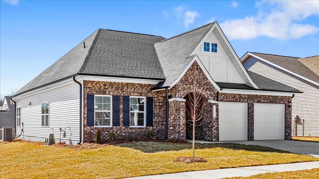 Front exterior of a new home in Brayden, Advance, NC, highlighting curb appeal (Image 2). Front exterior of a new home in Brayden, Advance, NC, highlighting curb appeal (Image 2).