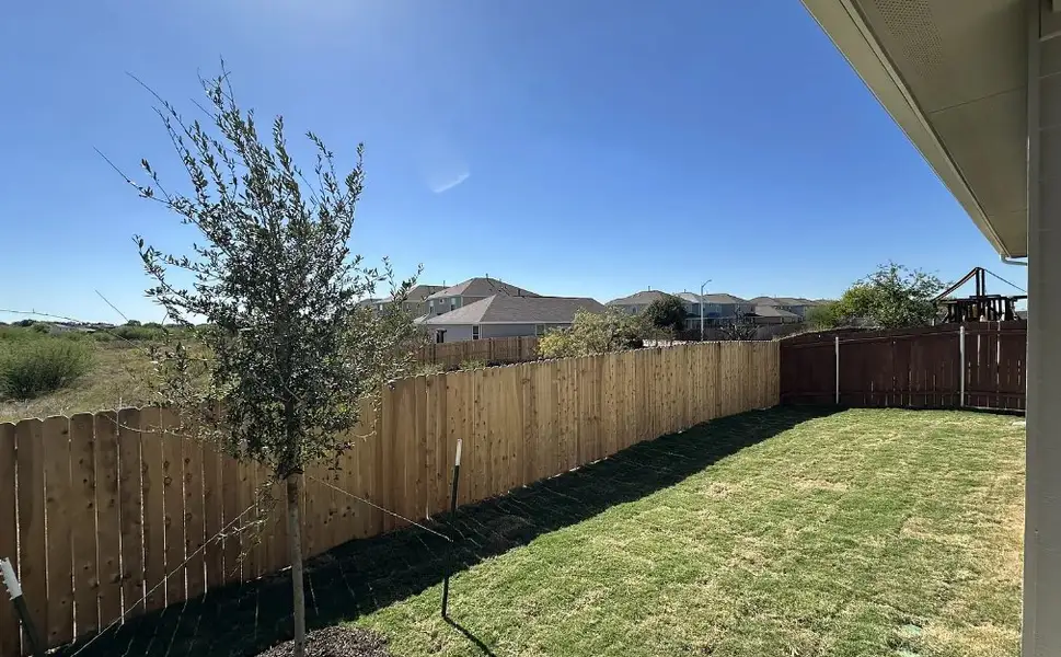Exterior details and patio area of a home in Porter Country, Buda (Image 3).
