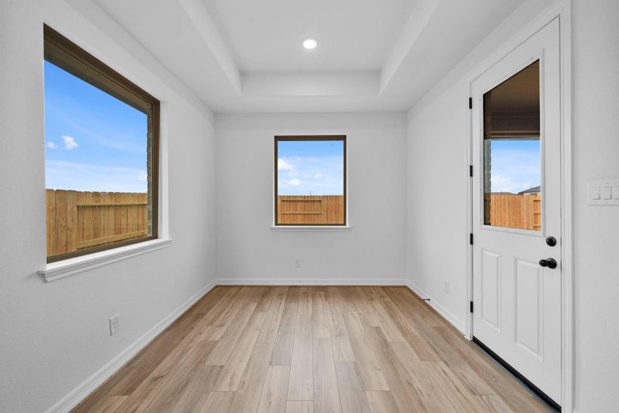 The breakfast nook is a sunlit spot for slow mornings, shared meals, and easy conversation.