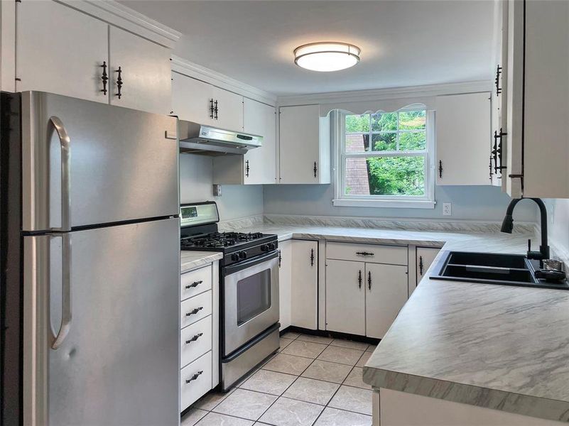 Feature countertops, sink, and paint.