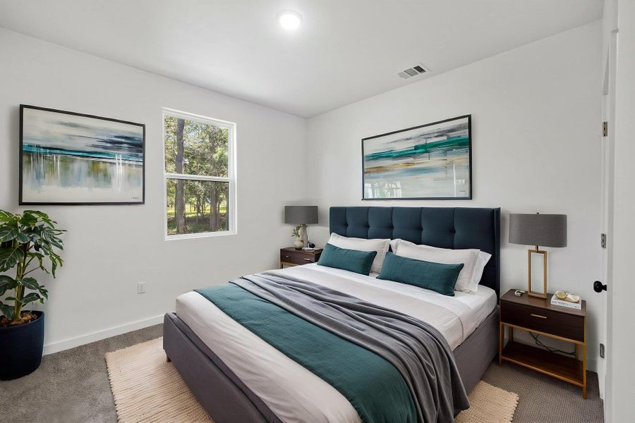 Bright windows and recessed lighting illuminate this welcoming bedroom retreat. Bright windows and recessed lighting illuminate this welcoming bedroom retreat.