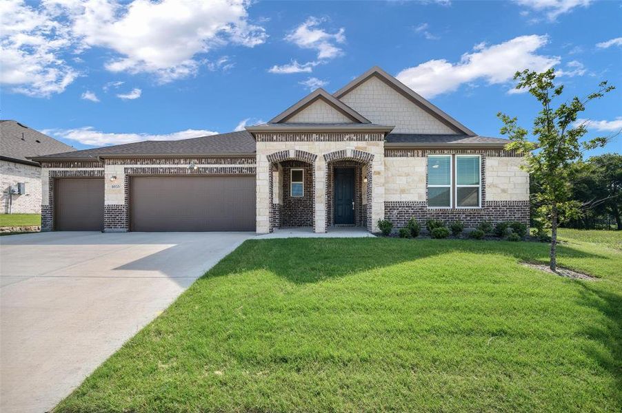 Front exterior of a new home in , Justin, TX, highlighting curb appeal (Image 1). Front exterior of a new home in , Justin, TX, highlighting curb appeal (Image 1).