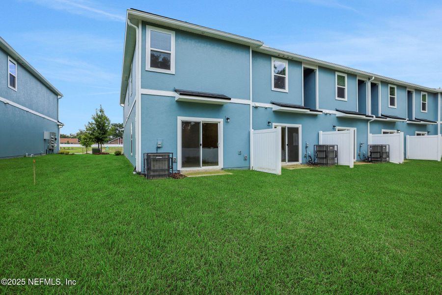 Front exterior of a new home in Kasen Oaks, Jacksonville, FL, highlighting curb appeal (Image 21).