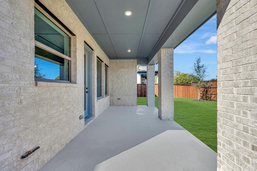 Exterior details and patio area of a home in South Pointe  Cottage Series, Mansfield (Image 2).