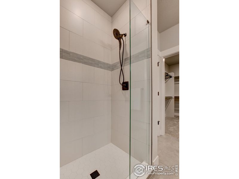 Primary Shower-  Photos not of the actual unit. Finishes vary.