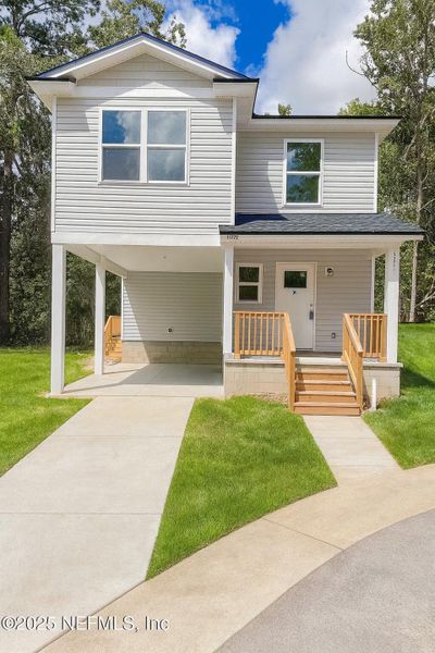 Front exterior of a new home in , Jacksonville, FL, highlighting curb appeal (Image 1).