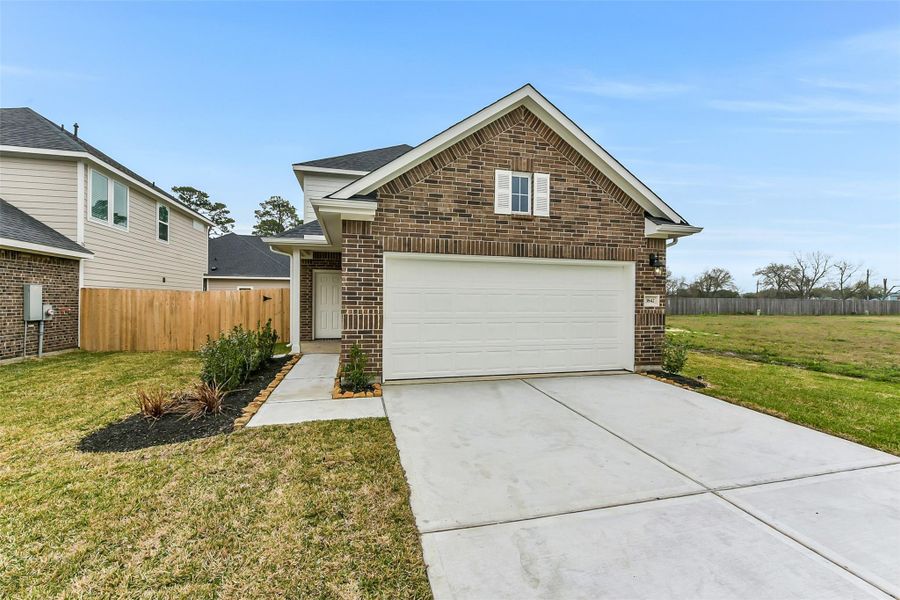 Front exterior of a new home in King Oaks Village, Baytown, TX, highlighting curb appeal (Image 21).