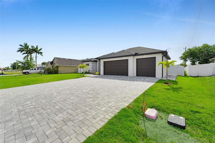 Front exterior of a new home in , Cape Coral, FL, highlighting curb appeal (Image 26).