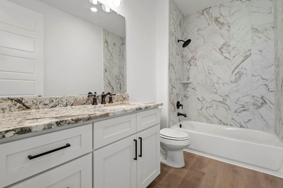 Full bathroom located downstairs for guests.