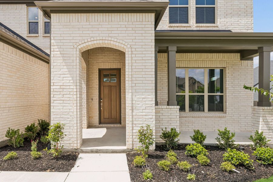 Exterior details and patio area of a home in Painted Tree Lakeside, McKinney (Image 21).