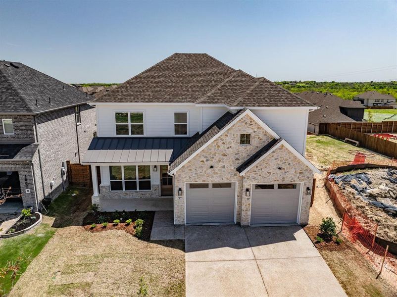 Front exterior of a new home in Solterra, Mesquite, TX, highlighting curb appeal (Image 24). Front exterior of a new home in Solterra, Mesquite, TX, highlighting curb appeal (Image 24).